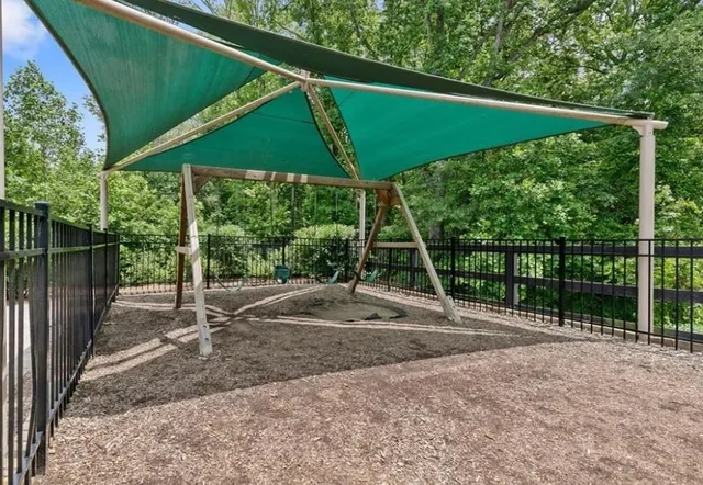 a view of a swimming pool and lounge chair