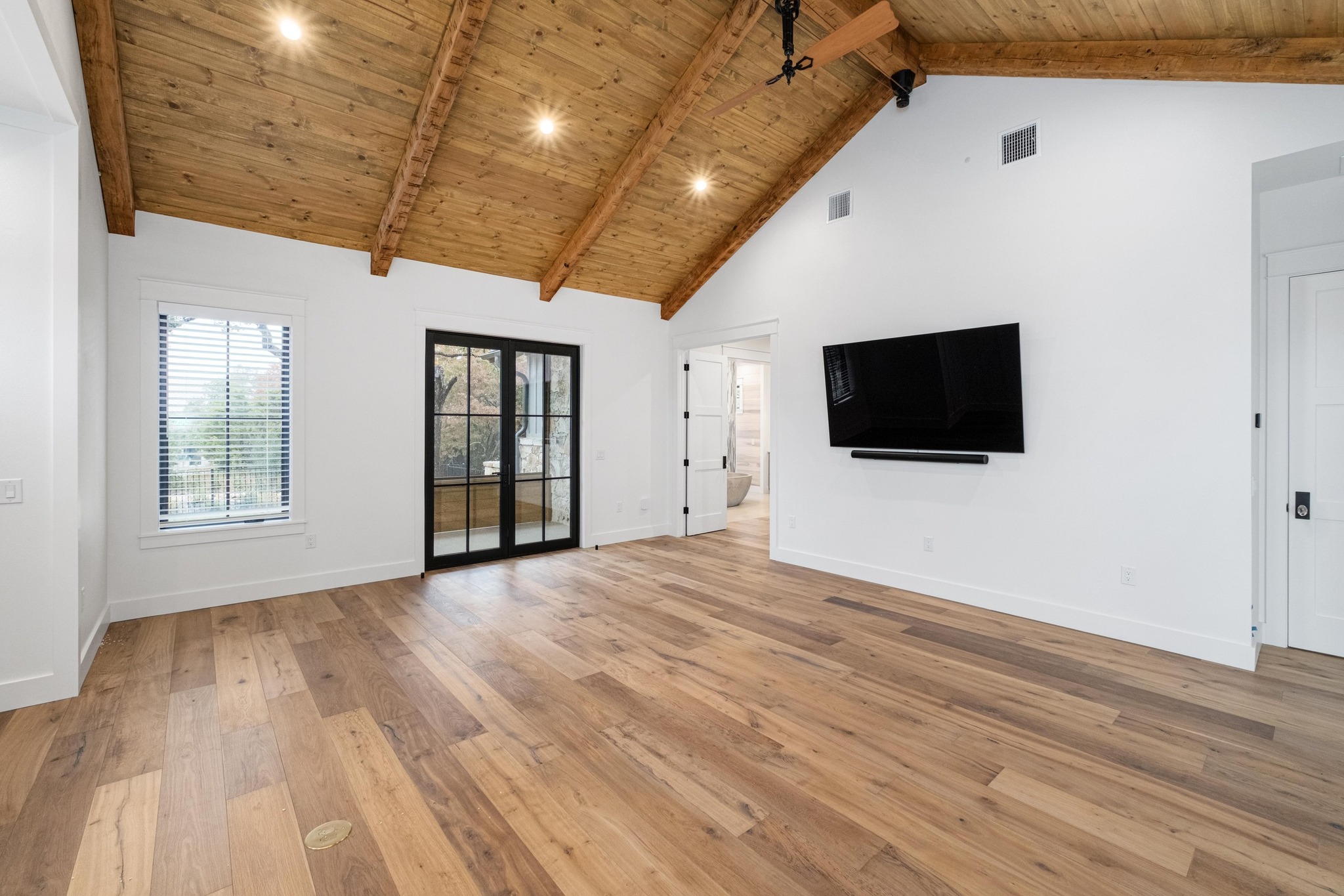 0 Old Red Ranch Road Dripping Springs, TX 78620 - Photo 13 of 40 a view of an empty room with wooden floor and a window