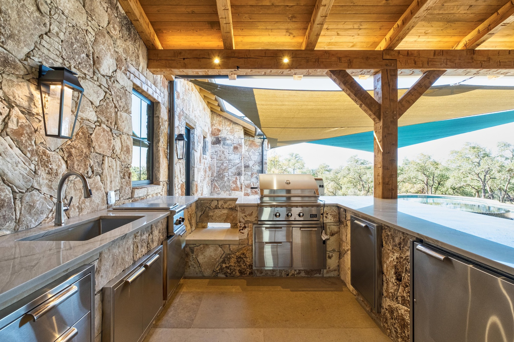 0 Old Red Ranch Road Dripping Springs, TX 78620 - Photo 39 of 40 a kitchen with stainless steel appliances granite countertop a sink and a stove