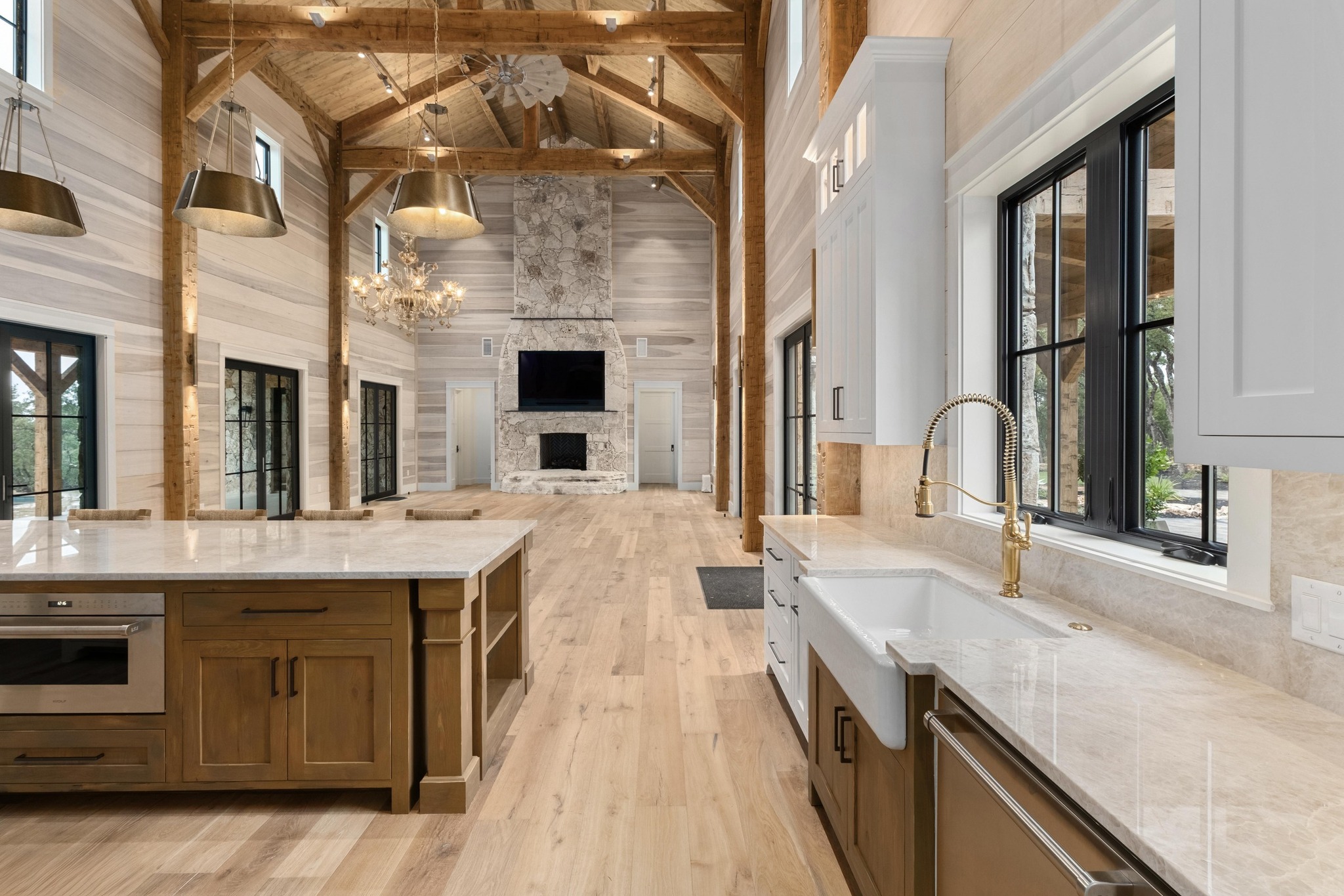 0 Old Red Ranch Road Dripping Springs, TX 78620 - Photo 9 of 40 a large kitchen with stainless steel appliances granite countertop a sink and stove