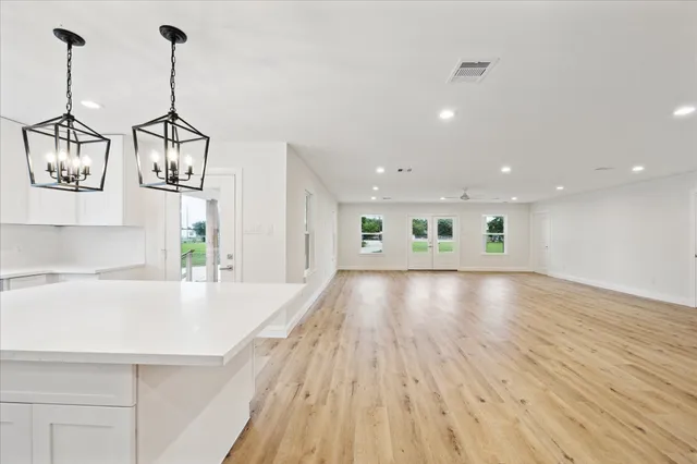 a view of a kitchen with wooden floor