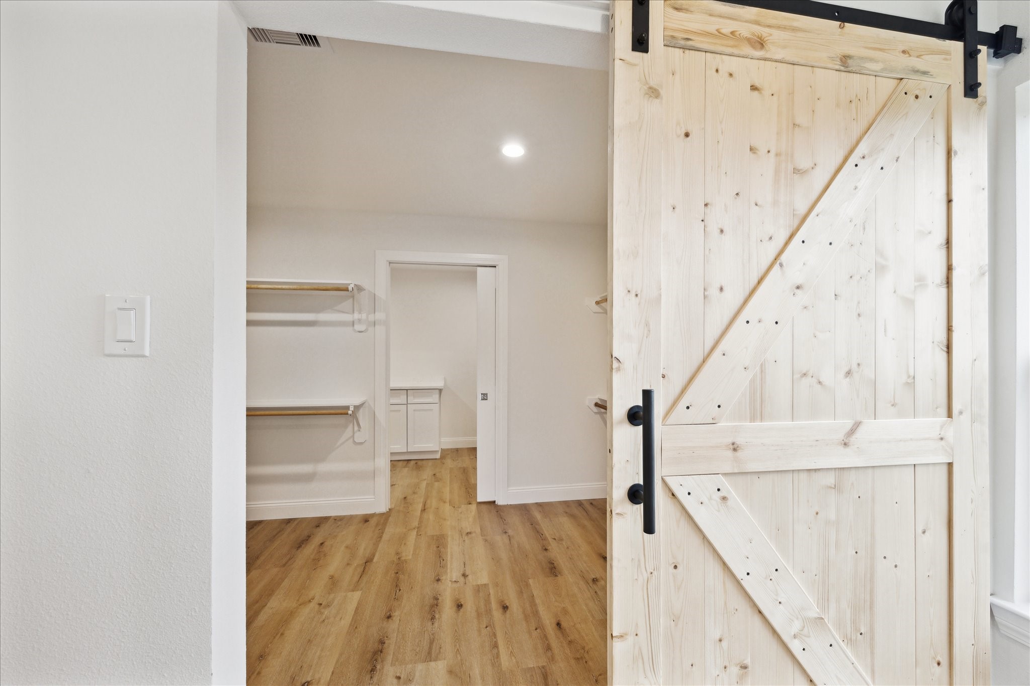 1935 Willow Road Wallis, TX 77485 - Photo 18 of 34 a view of hallway with wooden floor and staircase