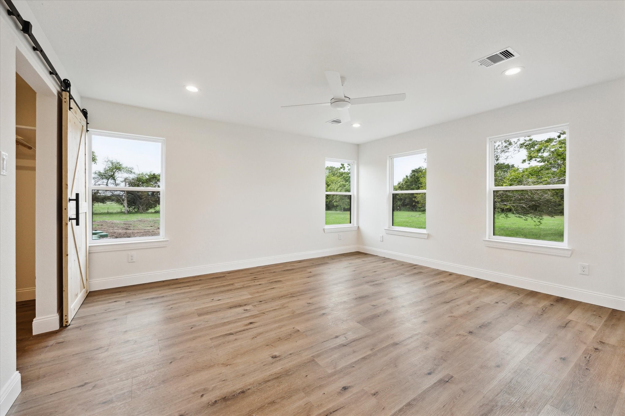 1935 Willow Road Wallis, TX 77485 - Photo 20 of 34 a view of an empty room with wooden floor and a window