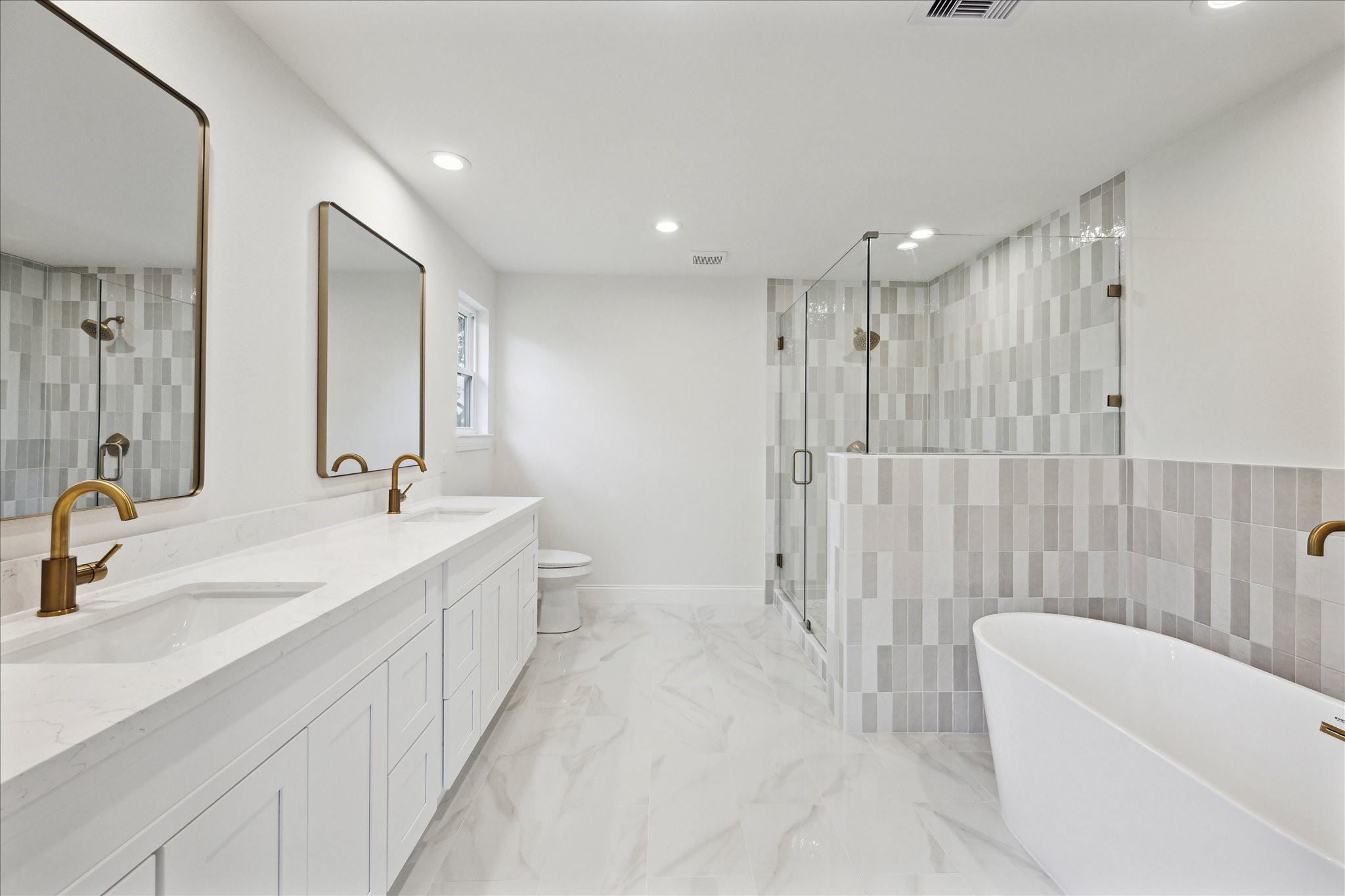 1935 Willow Road Wallis, TX 77485 - Photo 21 of 34 a bathroom with a double vanity sink toilet mirror and bathtub
