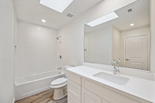 a view of a swimming pool with a bench in front of it