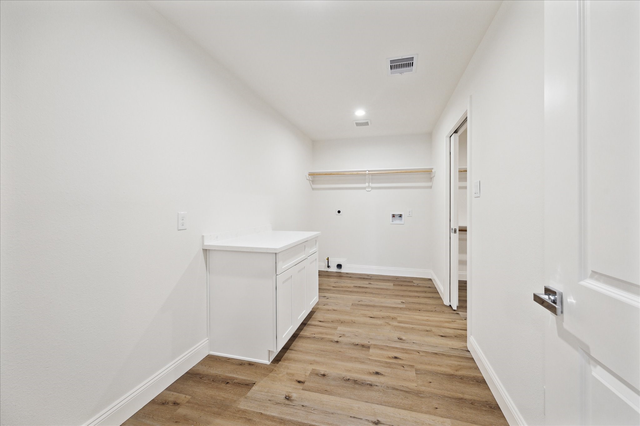 1935 Willow Road Wallis, TX 77485 - Photo 29 of 34 a view of a hallway with wooden floor