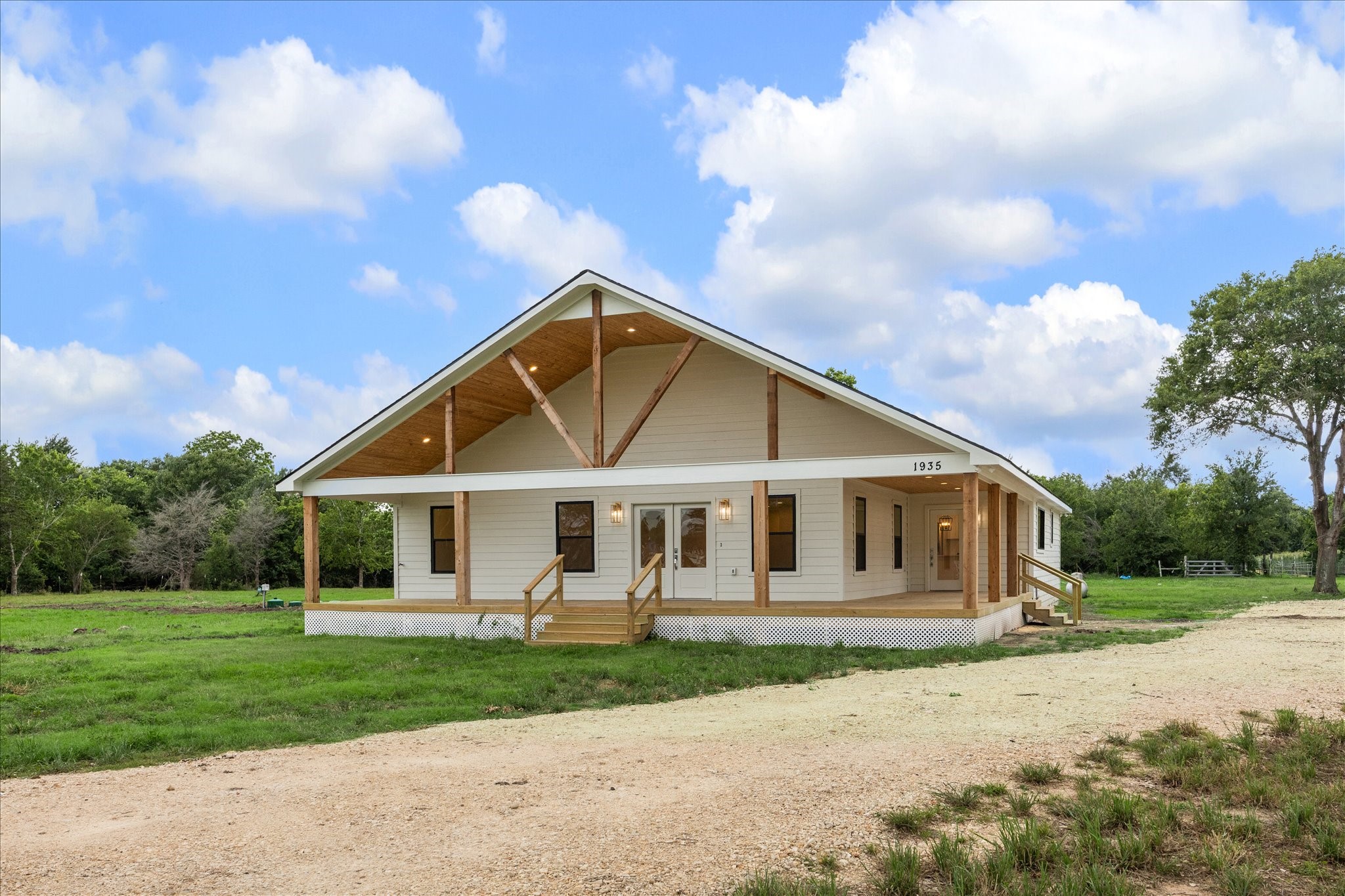 1935 Willow Road Wallis, TX 77485 - Photo 4 of 34 a front view of a house with a garden