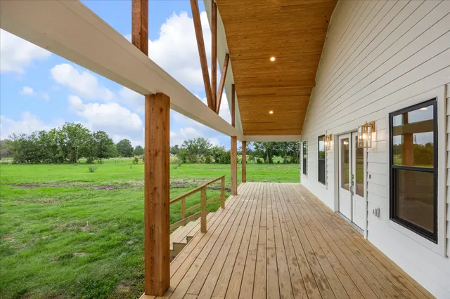 a view of porch with a garden