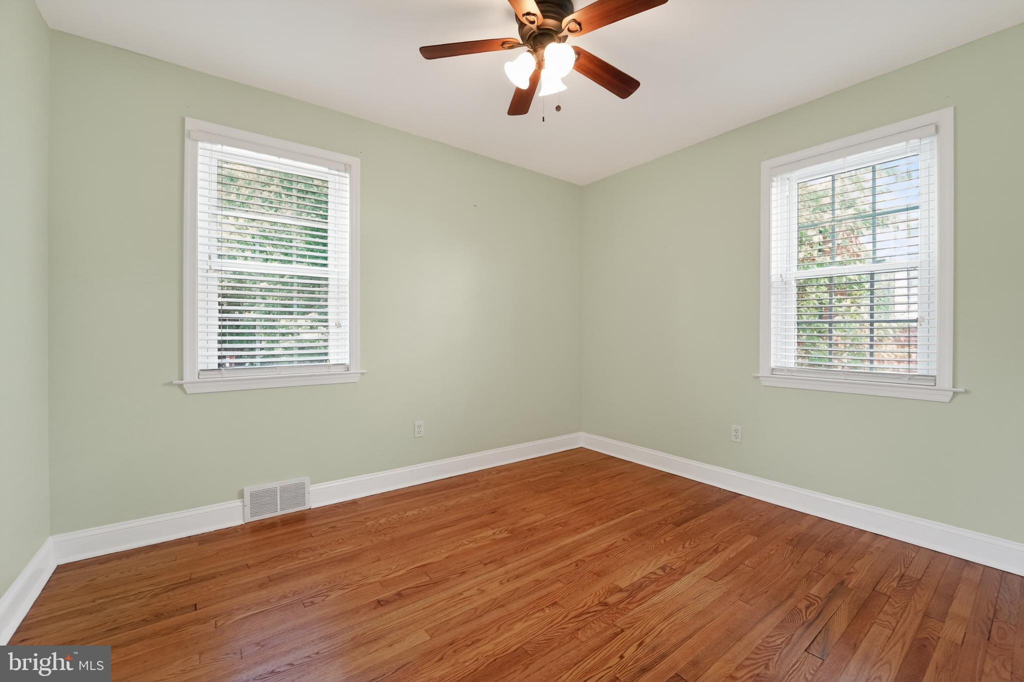 9408 Dana Vista Road Baltimore, MD 21236 - Photo 29 of 38 a view of a room with wooden floor and windows