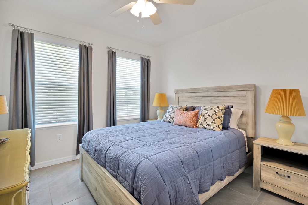 6035 Red Maple Manor Vero Beach, FL 32966 - Photo 18 of 36 a bedroom with a bed and a window