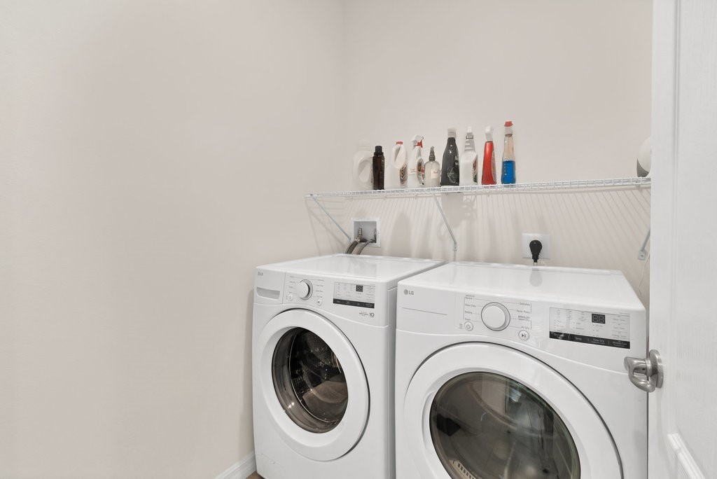 6035 Red Maple Manor Vero Beach, FL 32966 - Photo 24 of 36 a utility room with dryer and washer