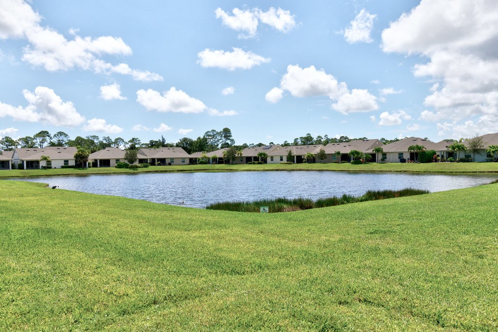 6035 Red Maple Manor Vero Beach, FL 32966 - Photo 28 of 36 a view of a golf course with a big yard