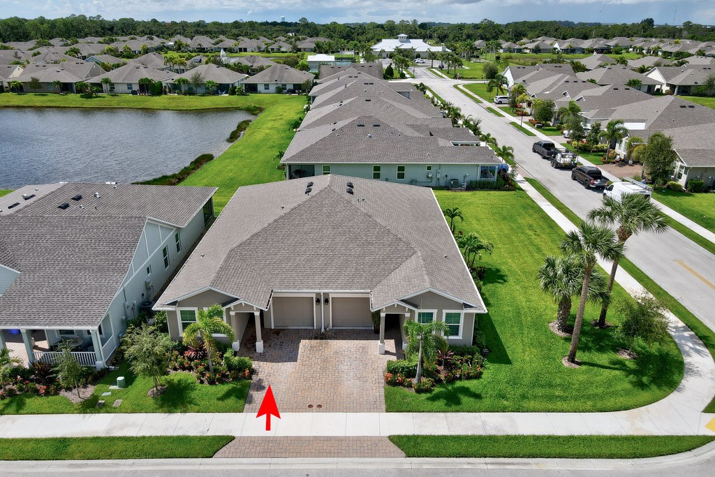 6035 Red Maple Manor Vero Beach, FL 32966 - Photo 5 of 36 an aerial view of a house with outdoor space and lake view