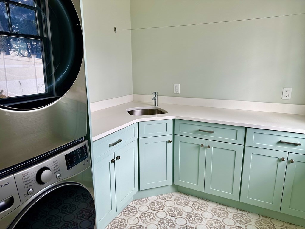 258 Reedsdale Road Milton, MA 02186 - Photo 11 of 34 a utility room with dryer and washer