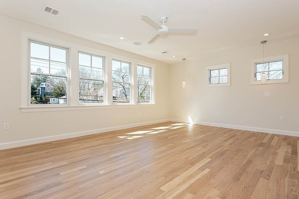 258 Reedsdale Road Milton, MA 02186 - Photo 15 of 34 a view of an empty room with wooden floor and a window