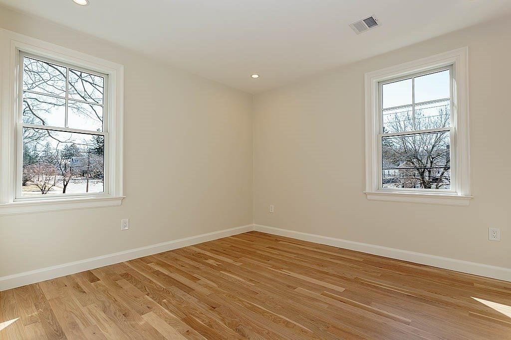 258 Reedsdale Road Milton, MA 02186 - Photo 21 of 34 a view of empty room with wooden floor and fan