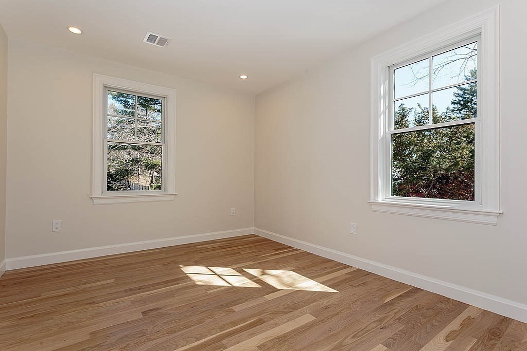 258 Reedsdale Road Milton, MA 02186 - Photo 22 of 34 a view of empty room with wooden floor and fan