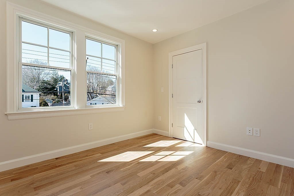 258 Reedsdale Road Milton, MA 02186 - Photo 25 of 34 an empty room with wooden floor and windows