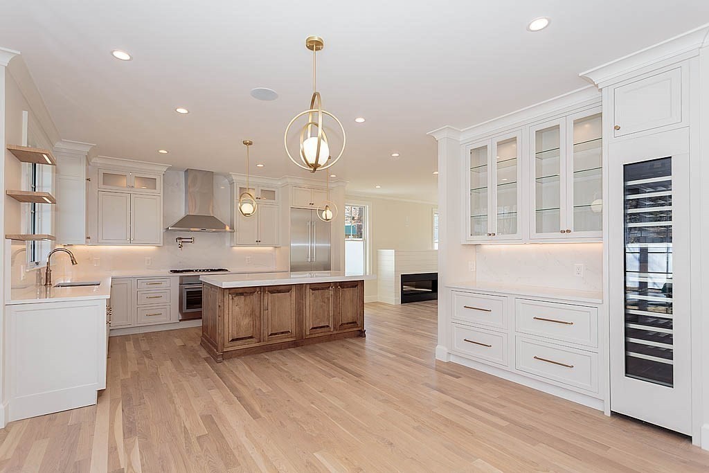258 Reedsdale Road Milton, MA 02186 - Photo 7 of 34 a large kitchen with kitchen island a sink stainless steel appliances and cabinets