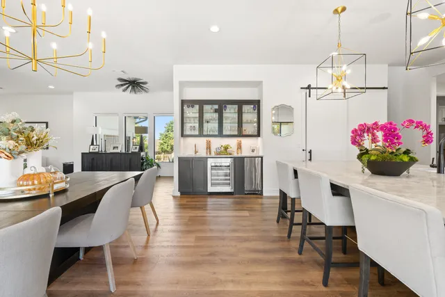 a dining room with furniture and window