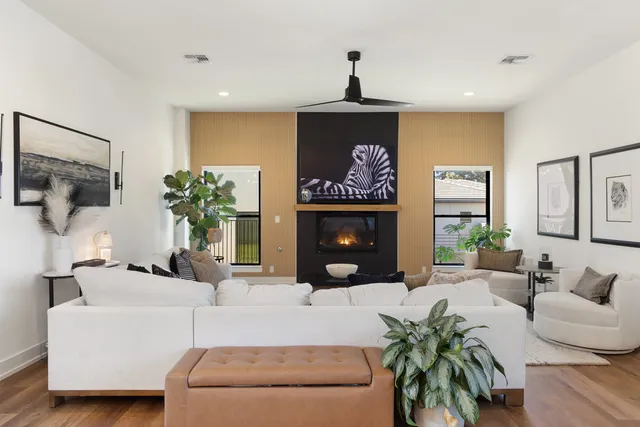 a living room with furniture and a fireplace