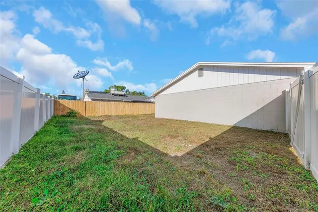 a view of an empty room with glass door