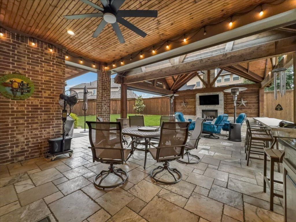 2832 Mona Vale Road Trophy Club, TX 76262 - Photo 11 of 37 a view of a patio with table and chairs