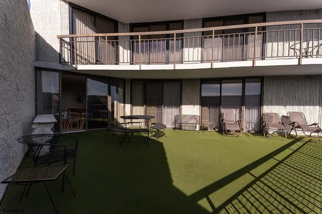 a view of balcony with furniture