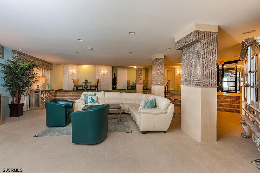 935 Ocean Avenue, Unit 315 Ocean City, NJ 08226 - Photo 34 of 37 a living room with furniture and a view of kitchen