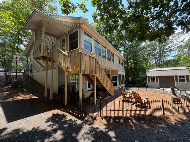 a view of a wooden door and a yard