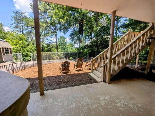 a kitchen with stainless steel appliances granite countertop sink stove and cabinets
