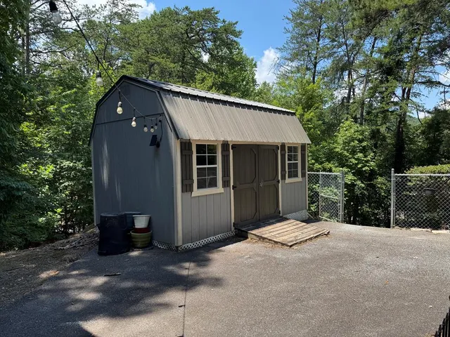 a kitchen with stainless steel appliances granite countertop a refrigerator a sink and a stove