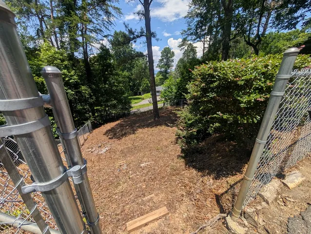 a kitchen with stainless steel appliances granite countertop a stove a refrigerator and a microwave