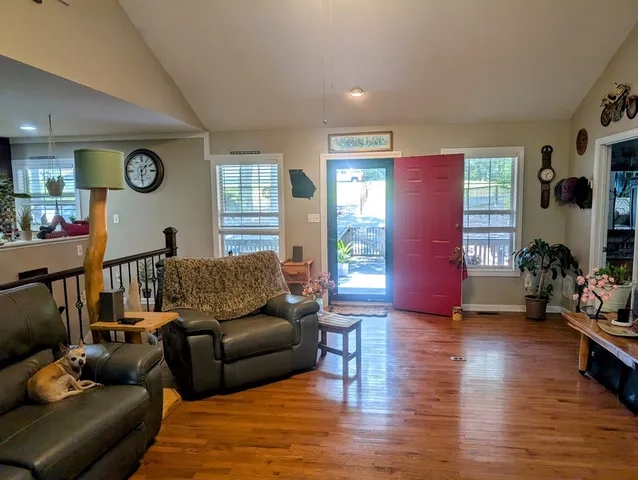 a bed room with furniture and a window
