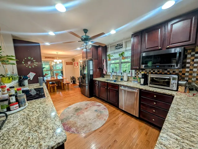 a bed room with a bed window and a television