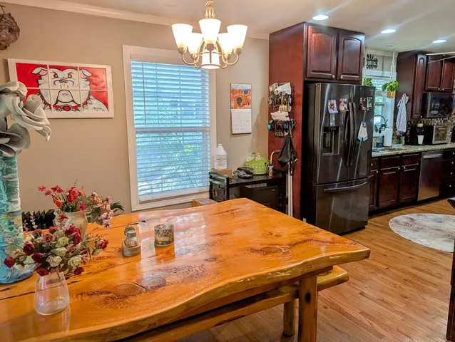 a kitchen with stainless steel appliances a refrigerator and a sink