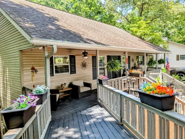 a view of a two chairs in the balcony