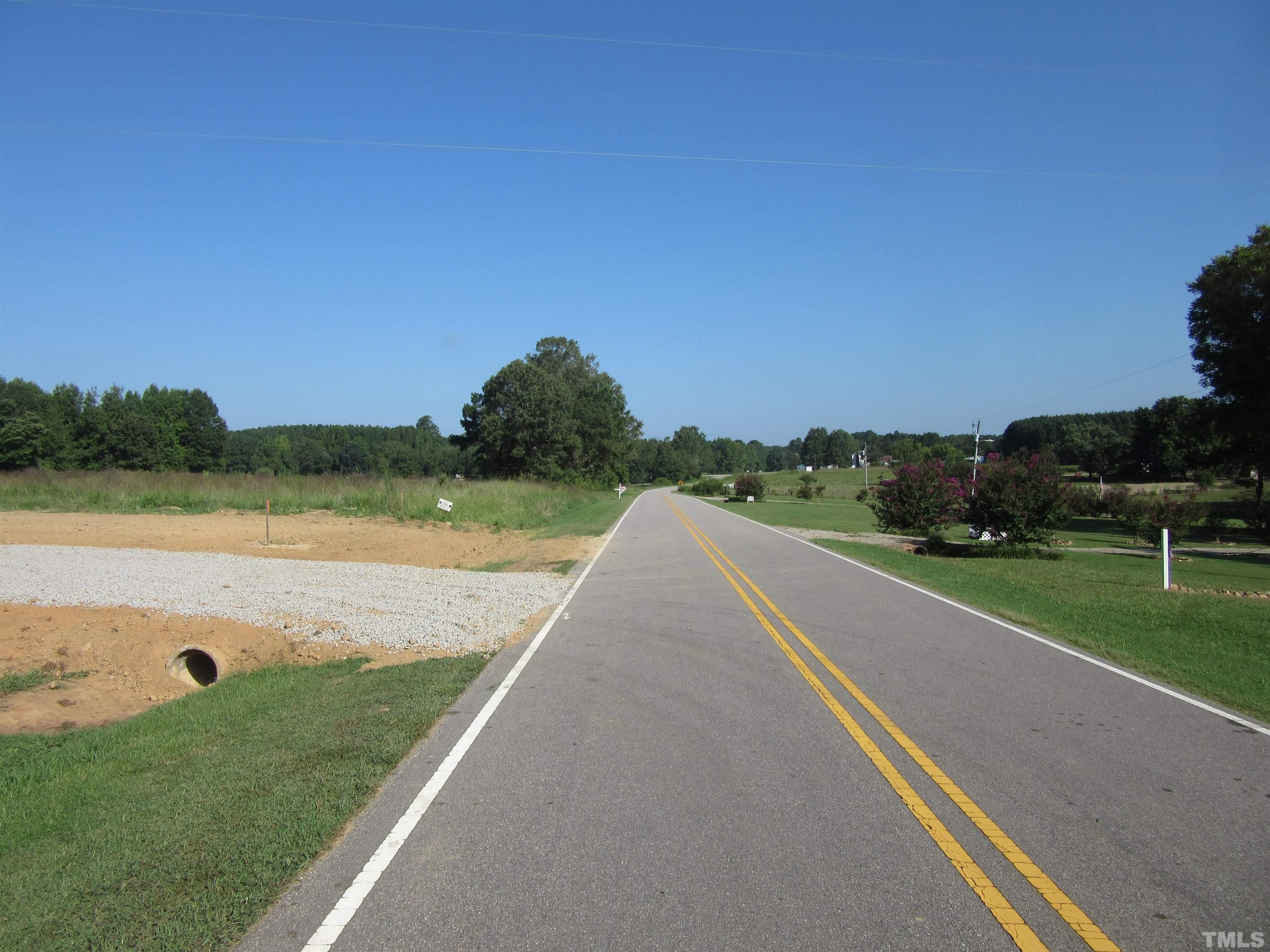 Lot 2 Seven Paths Road Spring Hope, NC 27882 - Photo 1 of 18 a view of a lake with a yard