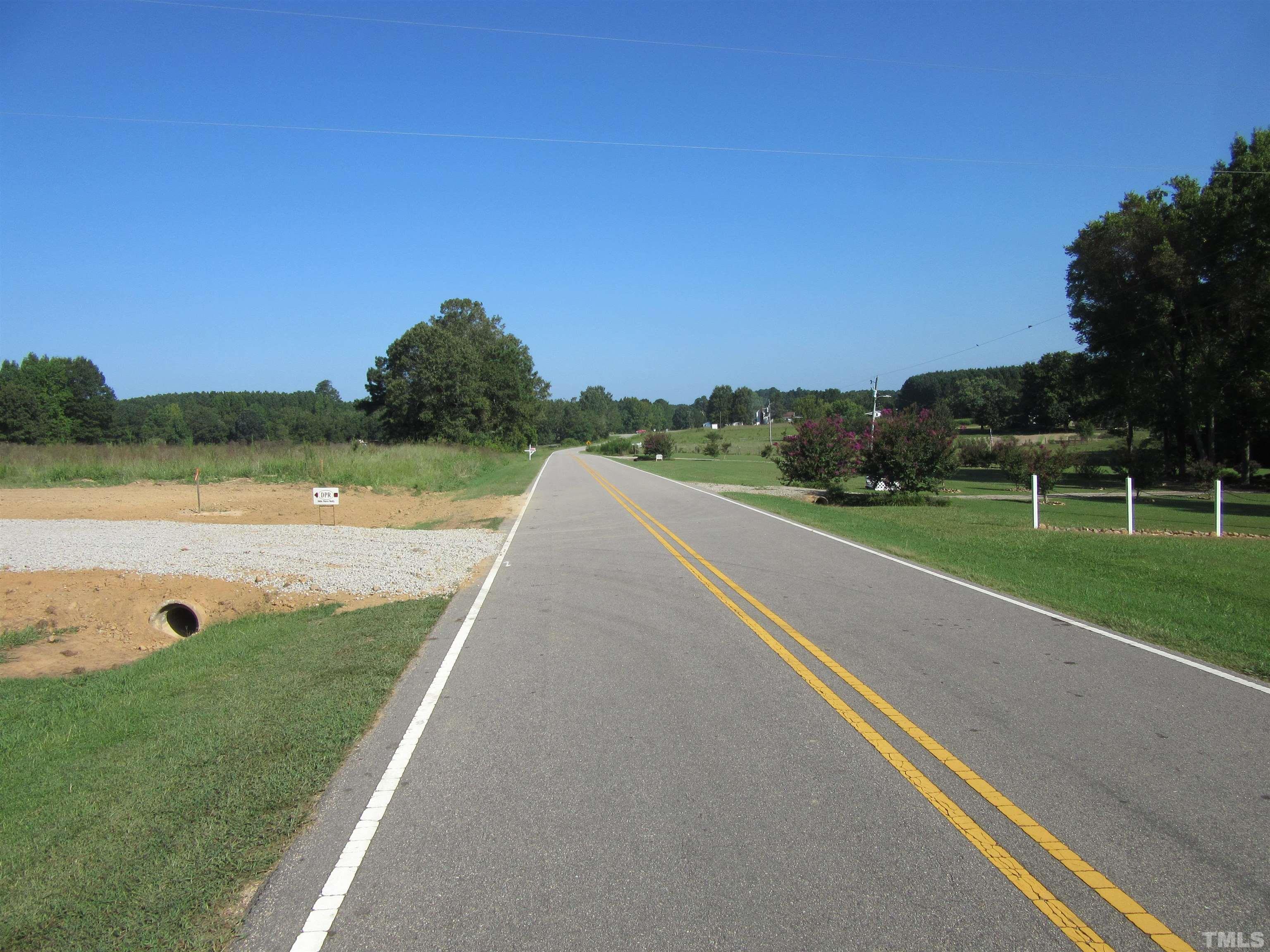 Lot 2 Seven Paths Road Spring Hope, NC 27882 - Photo 12 of 18 a view of a green field with clear sky view