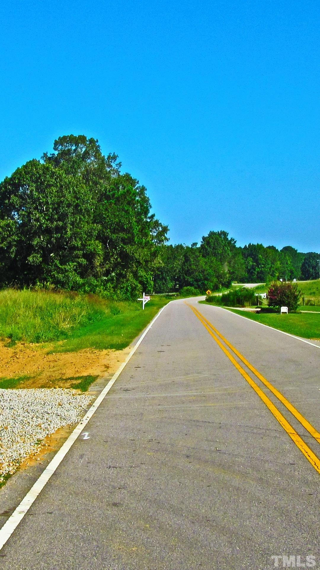 Lot 2 Seven Paths Road Spring Hope, NC 27882 - Photo 2 of 18 a view of a road with a yard