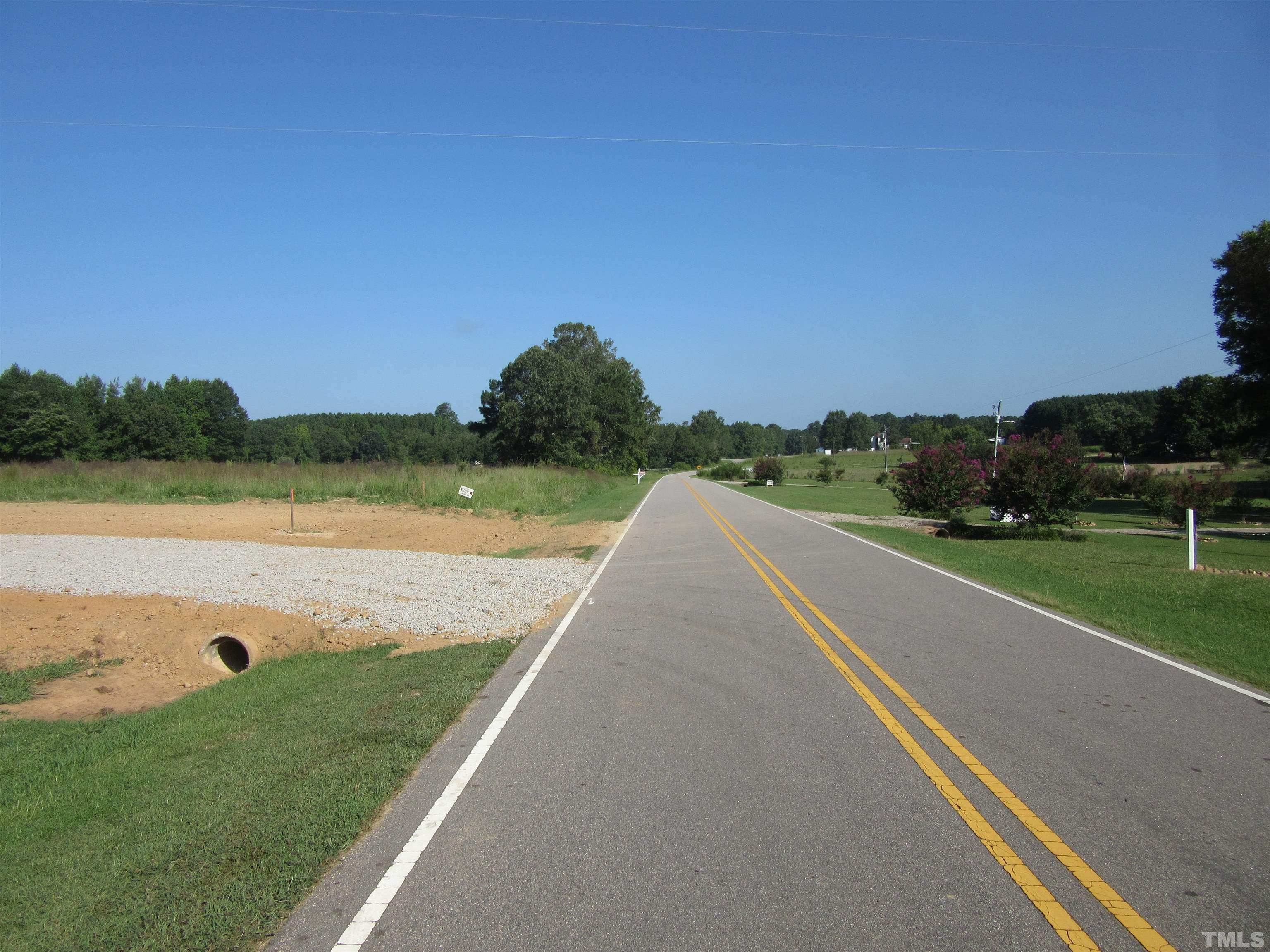 Lot 2 Seven Paths Road Spring Hope, NC 27882 - Photo 3 of 18 a view of a lake with a yard