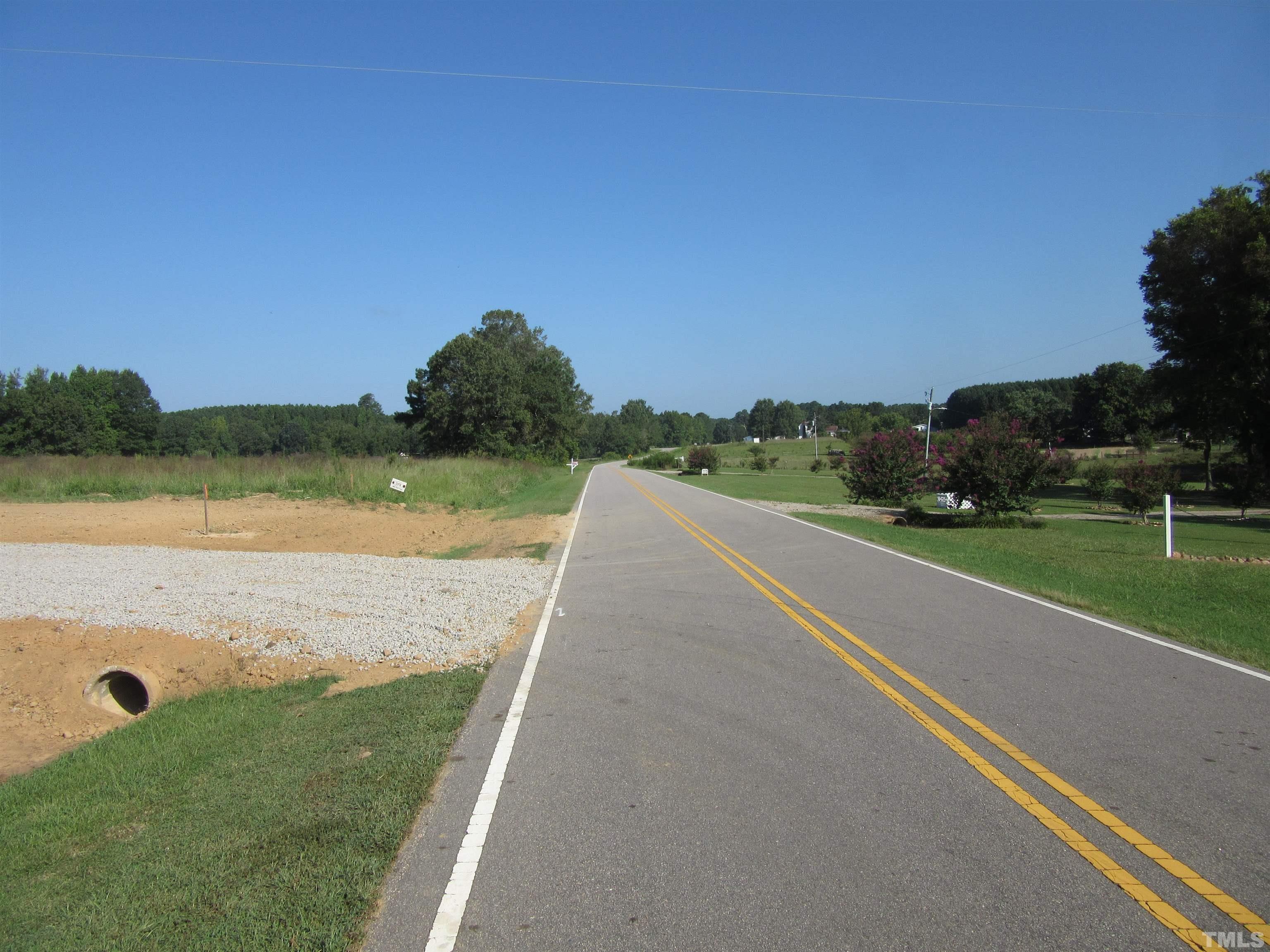 Lot 2 Seven Paths Road Spring Hope, NC 27882 - Photo 7 of 18 a view of a lake with a house in the background