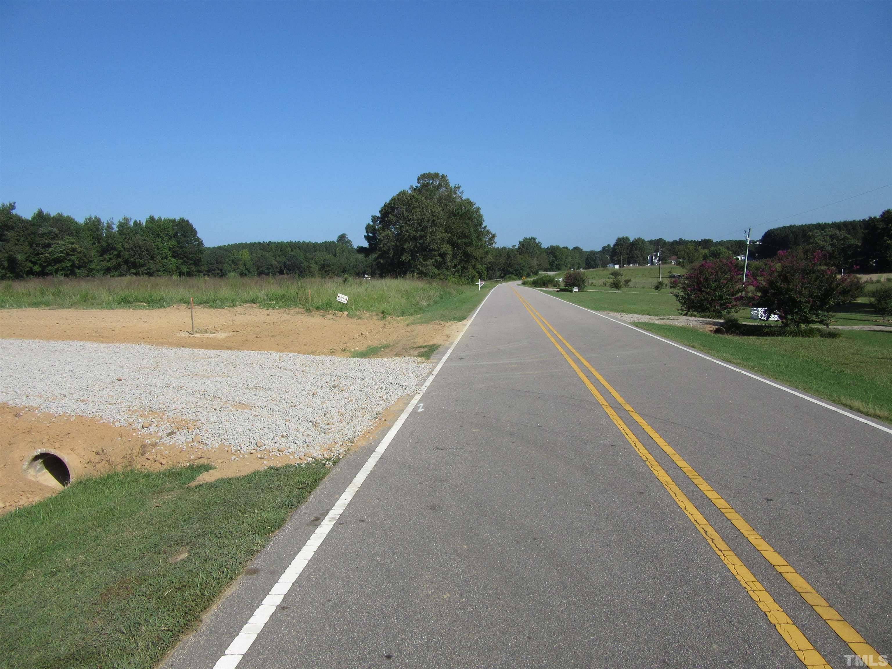 Lot 2 Seven Paths Road Spring Hope, NC 27882 - Photo 9 of 18 a view of a lake with a big yard