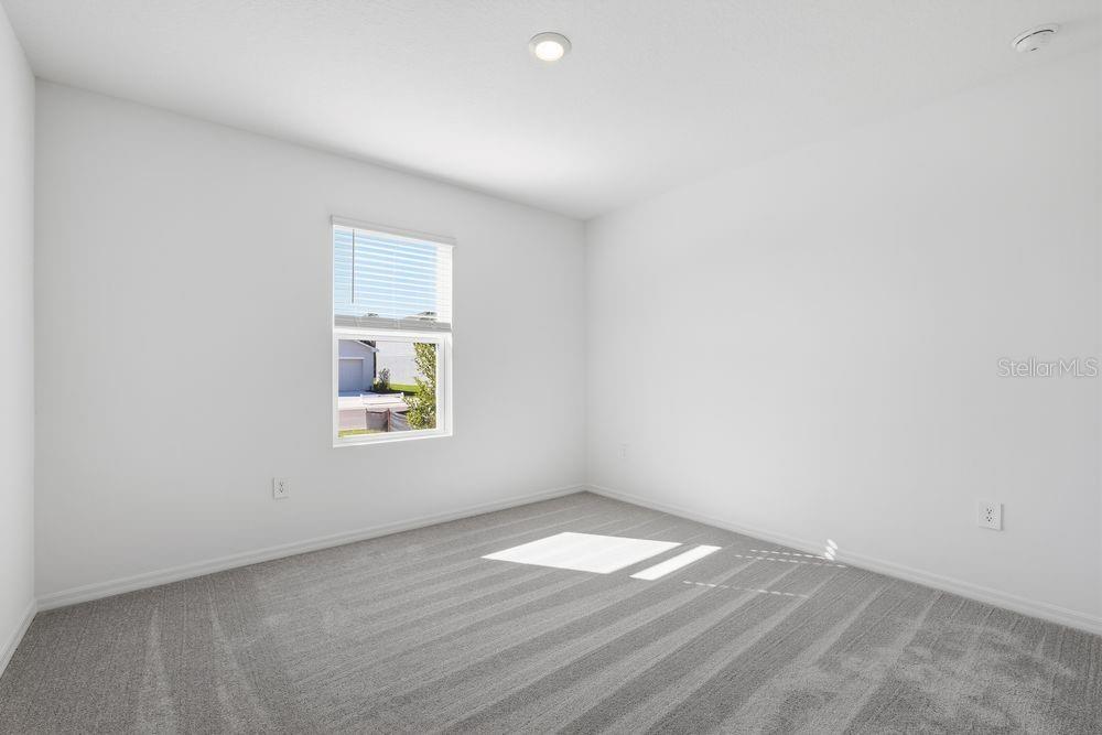 13640 Tropical Breeze Way Hudson, FL 34669 - Photo 23 of 48 an empty room with a window