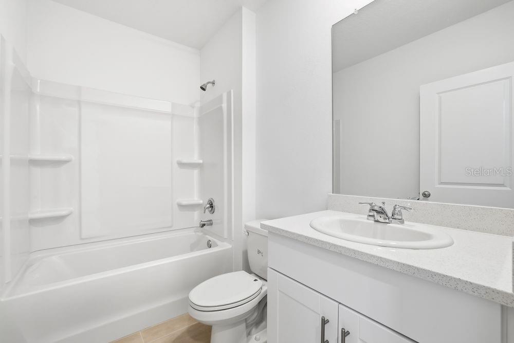 13640 Tropical Breeze Way Hudson, FL 34669 - Photo 28 of 48 a bathroom with a sink toilet and a bathtub