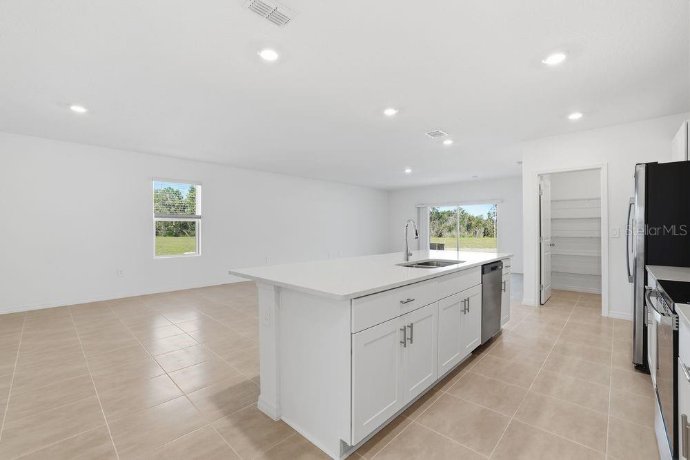 13640 Tropical Breeze Way Hudson, FL 34669 - Photo 3 of 48 a view of a kitchen with a sink