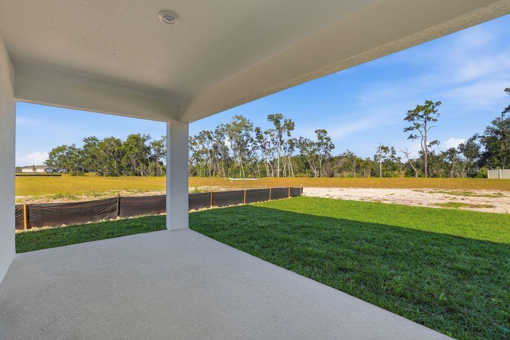 13640 Tropical Breeze Way Hudson, FL 34669 - Photo 32 of 48 a view of a lake with a big yard