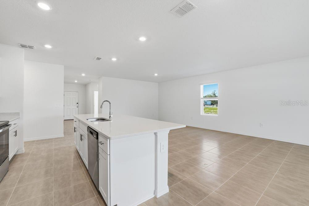 13640 Tropical Breeze Way Hudson, FL 34669 - Photo 5 of 48 an empty room with a sink and a window