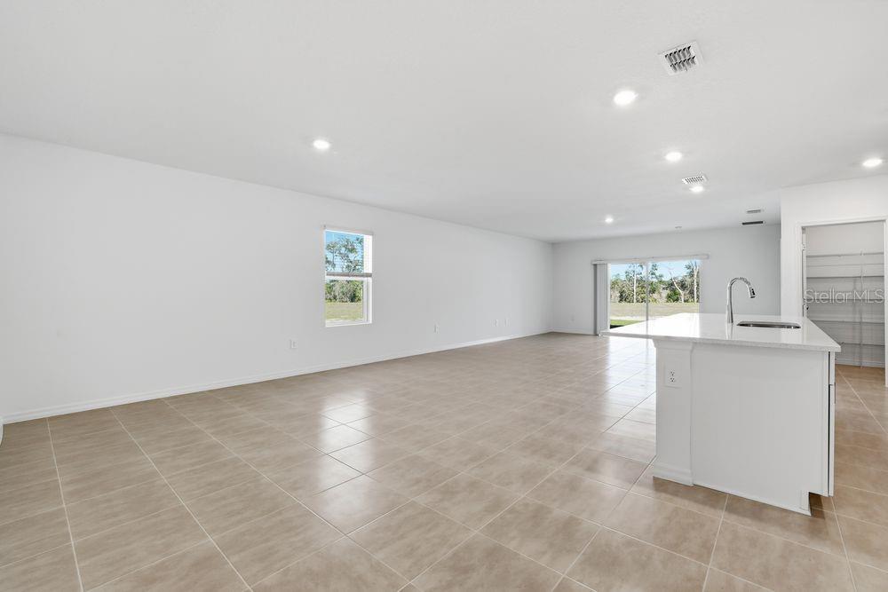 13640 Tropical Breeze Way Hudson, FL 34669 - Photo 9 of 48 a view of an empty room with a window