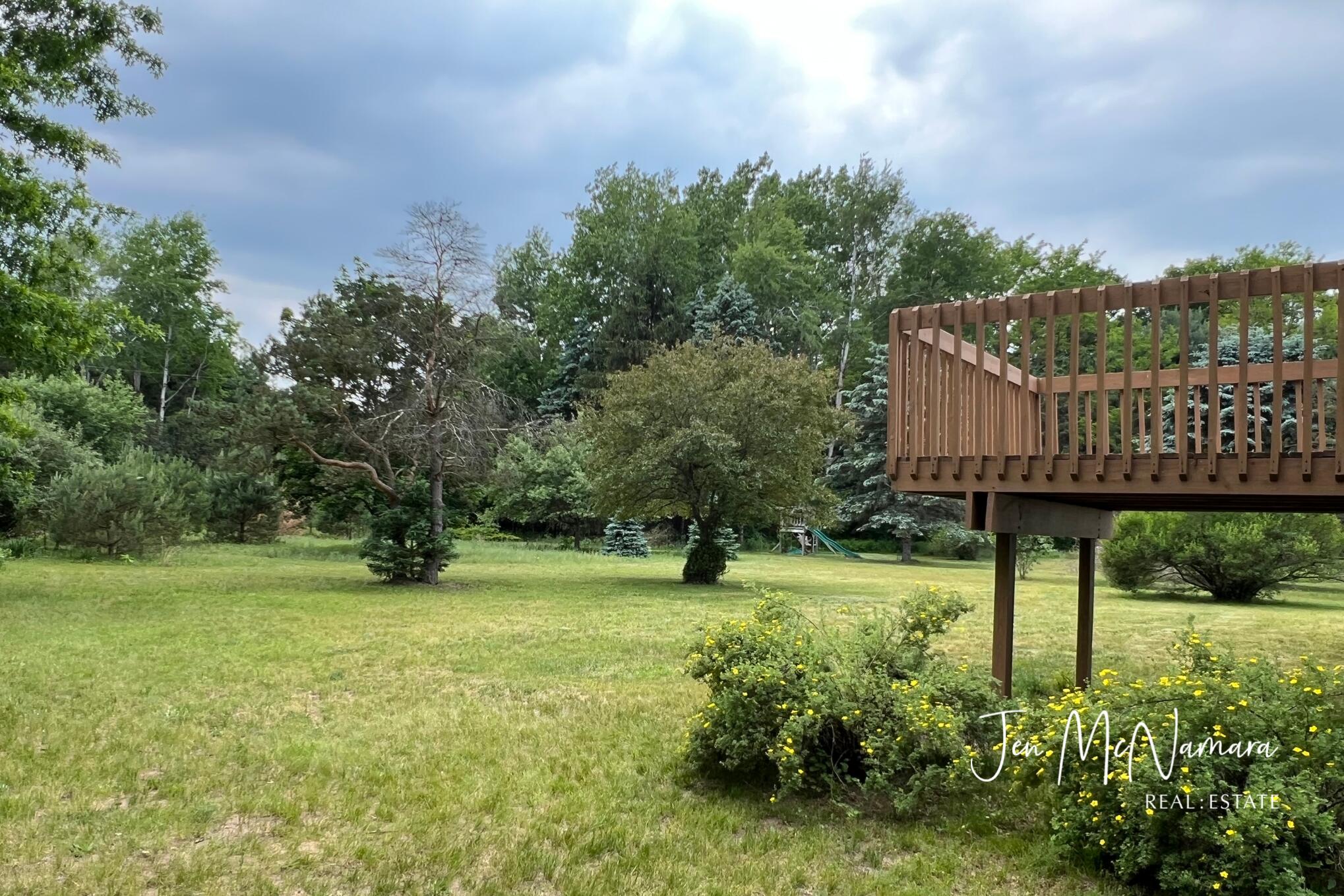4050 Rector Street Northeast Rockford, MI 49341 - Photo 25 of 32 Private Backyard w/ Deck